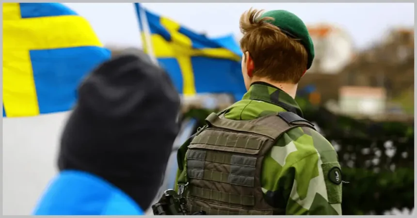 Swedish flag with uniformed military_1200x628 2024223 Sweden Eyes Expansion of Military Training Assistance to Ukraine